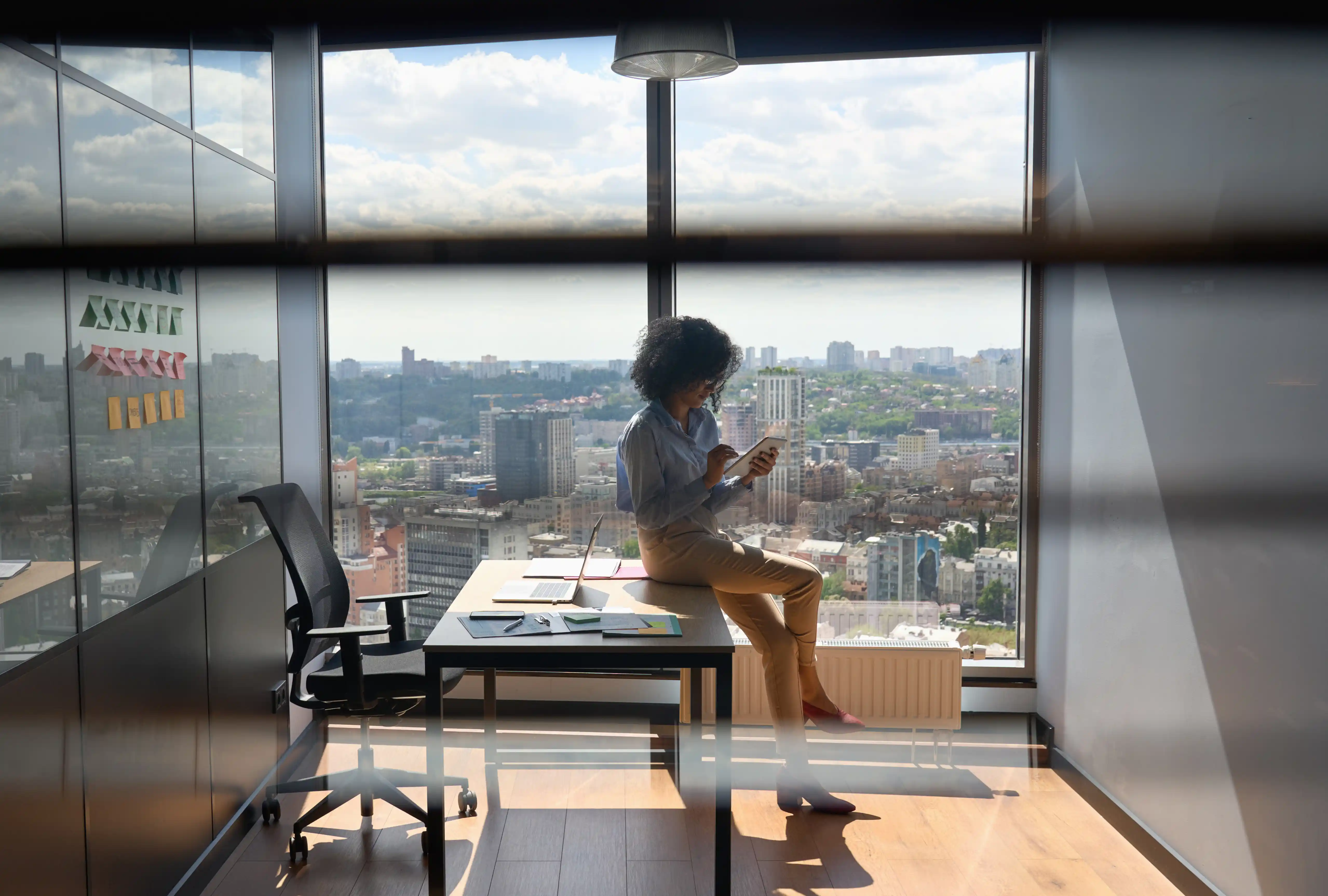 Business professional working with a tablet in a modern city office